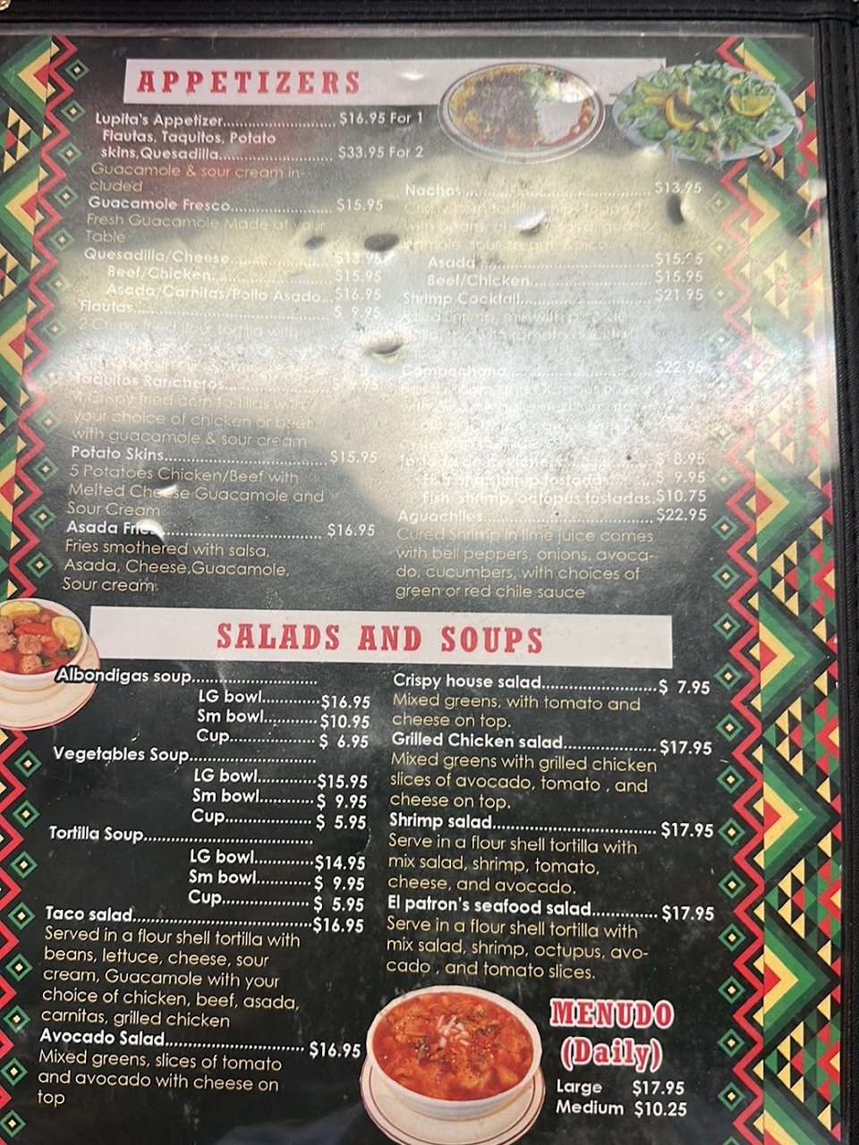 Assorted Mexican dishes served on white plates.